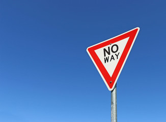 red, black and white No Way road sign in a bright blue sky