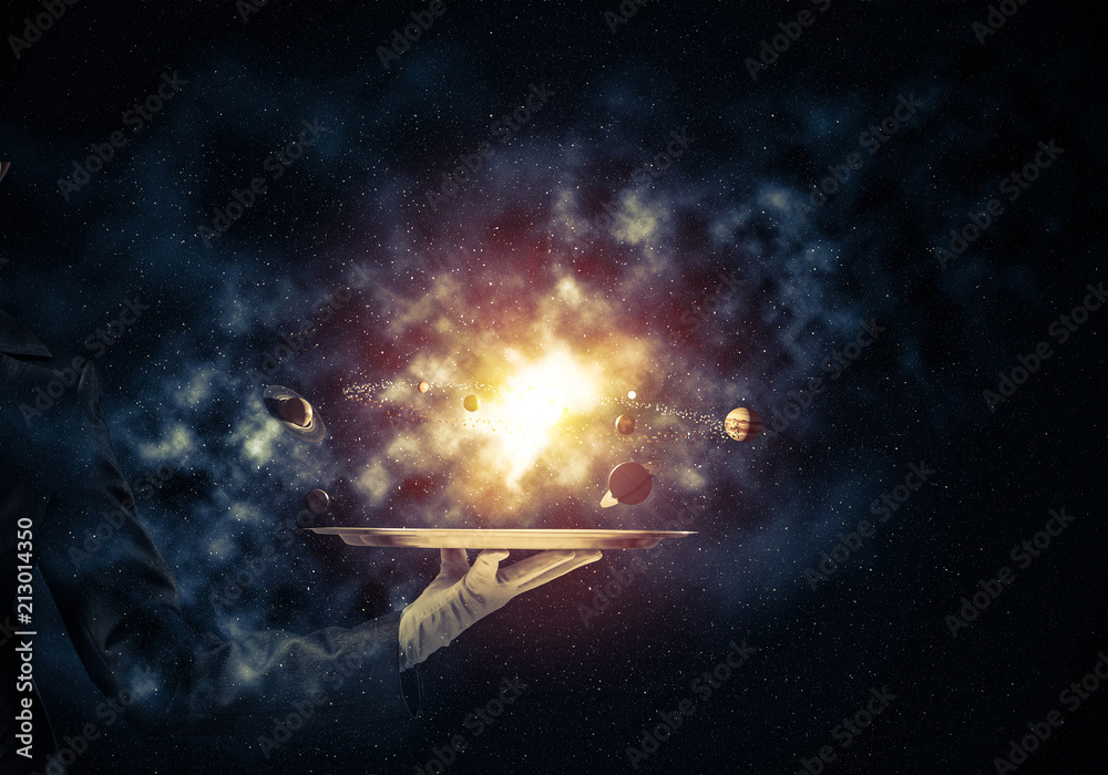 Wall mural hand of waitress presenting solar system on tray.