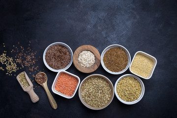 Mixed grains on dark background; overhead view