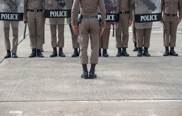 Riot police control the crowd..