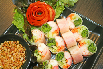 Fresh spring rolls and sweet sauce top view background