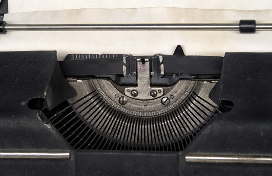typewriter with Russian font with paper sheet.
