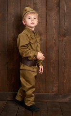 children are dressed as soldier in retro military uniforms