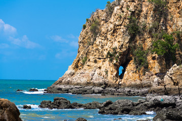 Fototapeta na wymiar Hole in the rock near the sea, marine cave,Grotto