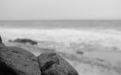 stones on the beach in black and white