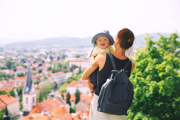 Woman and child on background of Ljubljana City, Slovenia. Travel Europe.