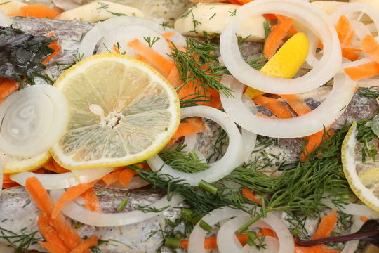 Preparation a marinated hake with potatoes for baking in the oven. Details