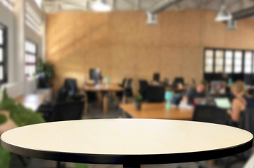 Selected focus empty brown wooden table in office with big windows of the Background with bokeh image. for your photomontage or product display
