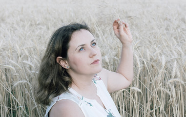 Woman in wheat field background