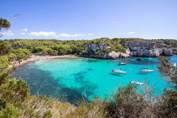 Fototapeta na wymiar Boats and yachts on Macarella beach, Menorca, Spain