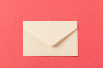 Paper envelopes on a colored pink background