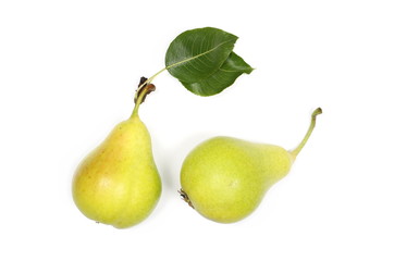 Fresh ripe pears with twig and leaf isolated on white background, top view