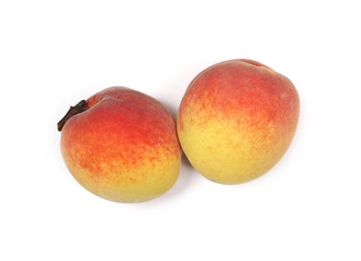 Fresh ripe peach fruits isolated on white background, top view