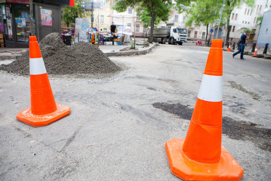 Plastic road cone. Road sign for temporary fencing while carrying out repairs on the road