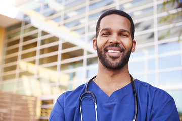Smiling black male healthcare worker, head and shoulders