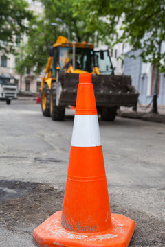 Plastic road cone. Road sign for temporary fencing while carrying out repairs on the road