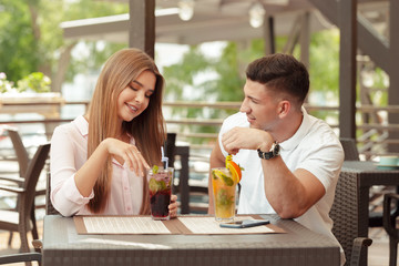 Two people in cafe enjoying the time spending with each other