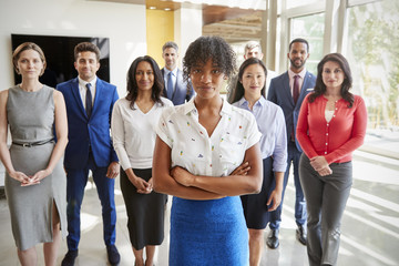 Obraz premium Black businesswoman and her business team, group portrait