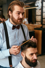 Men Hair Salon. Man Barber Doing Hairstyle In Barbershop