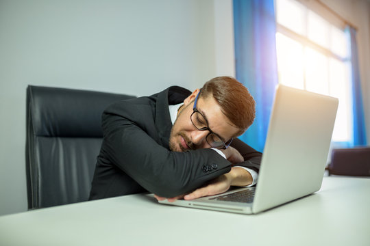 Businessman employee sleep relaxing in office