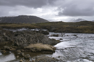 Landscape with rocks and water spring. Iceland