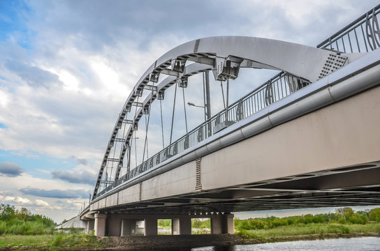 Fototapeta Suspension bridge on the background of dramatic sky