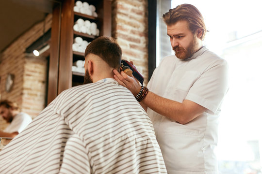 Barber Shop. Man Getting Haircut In Hair Salon