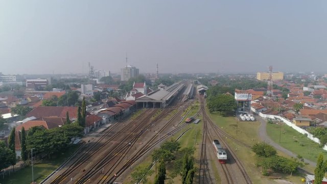 Aerial View of Cirebon Train Station with a Diesel Locomotive Engine Haul Passenger Car, West Java Indonesia, Asia