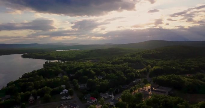 4K flyby of small town in the North Woods of Maine during golden hour.