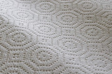 Perforations on white paper towel
