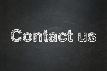 Obraz premium Finance concept: text Contact us on Black chalkboard background