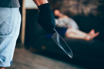 Wicked and evil murderer attempt to kill a woman in danger with a knife - homicide and violence society problem concept.