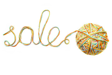 Word sale made of colorful thread and thread ball isolated on white background. Cotton yarn curly line with word sale.