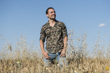 attractive man posing in the park