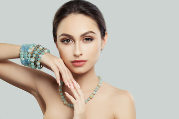 Pretty Young Woman with Makeup, Manicure Jewelry Bracelet and Necklace