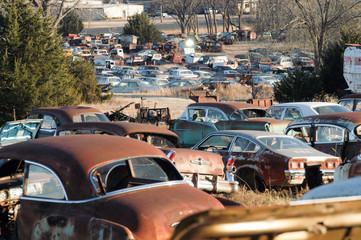 Vintage cars standing on wreckage junk yard, Oklahoma