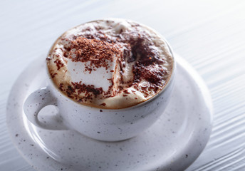 Hot chocolate and marshmallow sprinkled with chocolate chips.