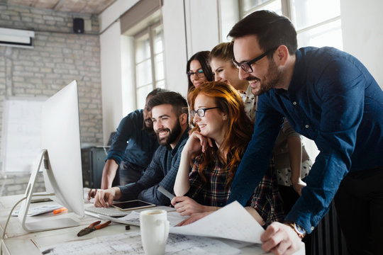 Group of young designers working as team