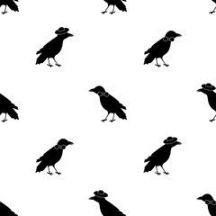 Seamless pattern with black ravens, tie and hats on the white background