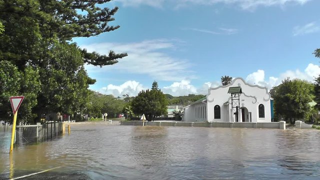 A flooded intersection in front of a severely flooded Dutch Reformed Church in the town of Bushmans River in the Eastern Cape, South Africa.