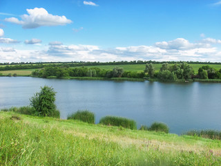csenic view of counrtyside, valley and a field