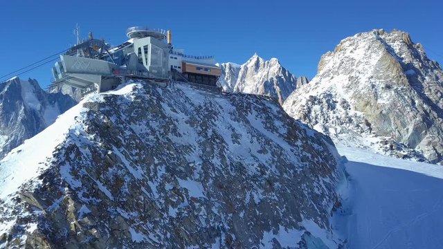 mountain ropeway from above with snow glacier drone shot