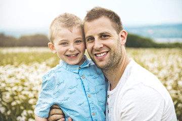 Fototapeta premium Father spending time with son during the sunset.