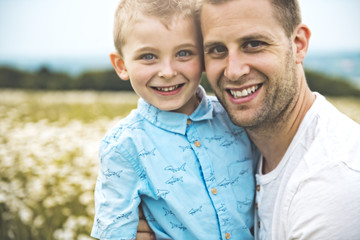 Fototapeta premium Father spending time with son during the sunset.