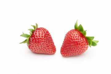 Two strawberries isolated on white background