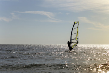 Surfing at Sunset. Outdoor Active Lifestyle.