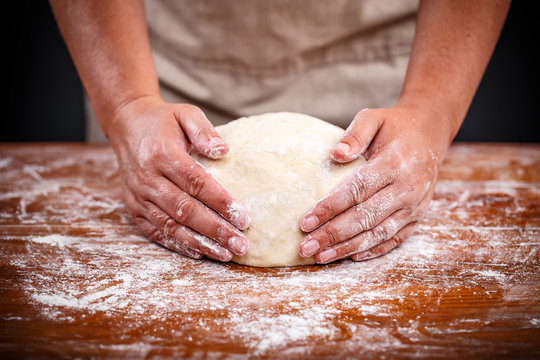 Baker hands making sourdough bread