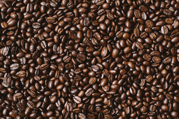 full frame image of fresh dark roasted coffee beans. can be use as background,wallpaper and backdrop