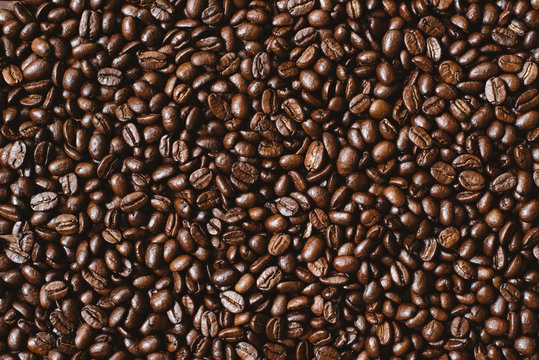full frame image of fresh dark roasted coffee beans. can be use as background,wallpaper and backdrop