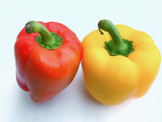 Colourful bell peppers or capsicums. A capsicum is of red and another is ye